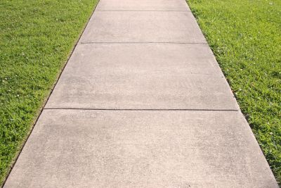 Concrete Walkways Vs. Pavers: Which Option Fits Your Property Best